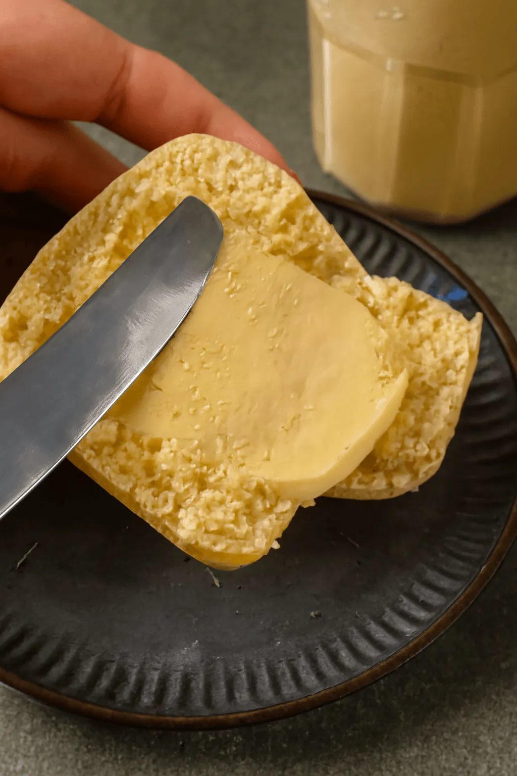 Creamed honey spread on a slice of bread
