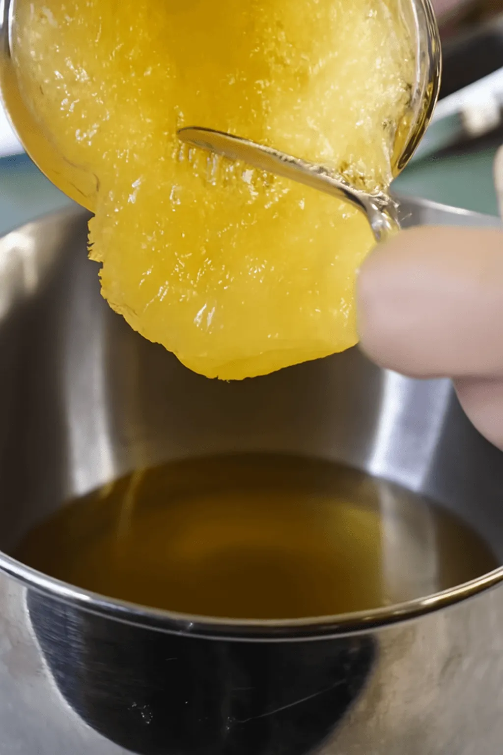 Crystallized honey and raw honey combined in a bowl

