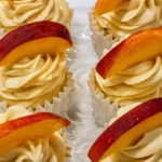 Honey peach cream cheese cupcakes topped with peach slices
