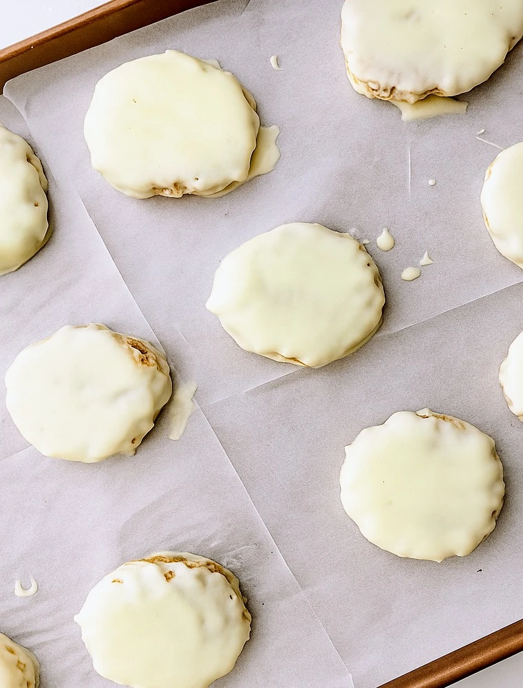 lemon oatmeal no bake cookies on a baking sheet lined with parchment paper