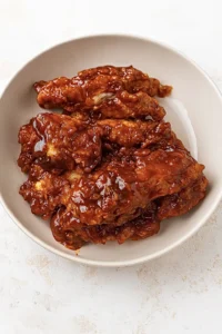 Spicy BBQ chicken tenders coated in sticky honey barbecue sauce